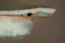 Sample in cross section, magnified 200x, shows layered technique and gold below blue